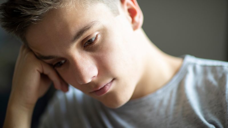 young man looking sad